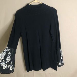 Black sweater with floral sleeves